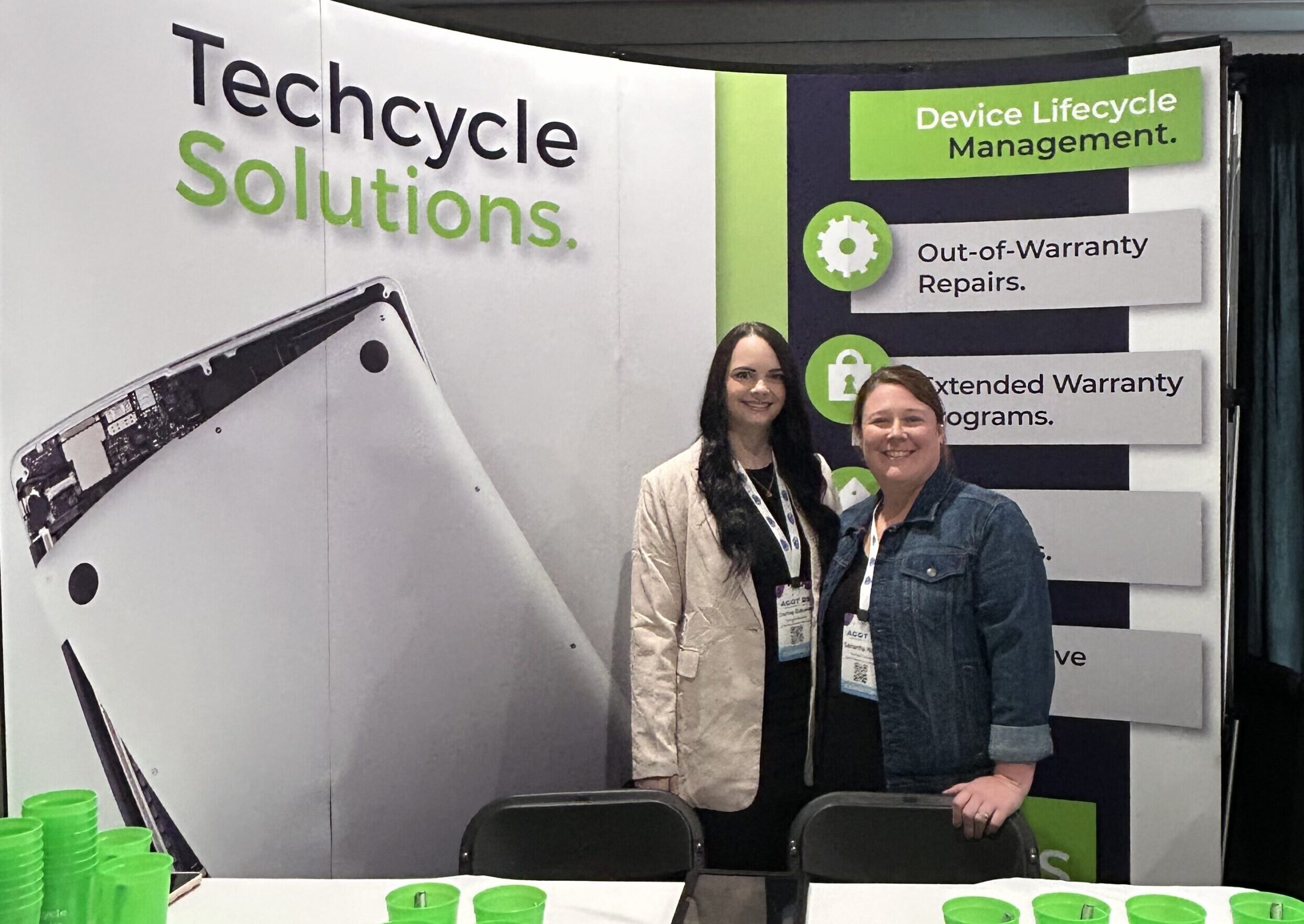 Two members of the Techcycle Solutions team, Sam and Courtney, exhibiting at the ACOT 2025 conference, demonstrating the importance of face-to-face meetings